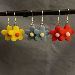 Yellow rubber flower earrings.
